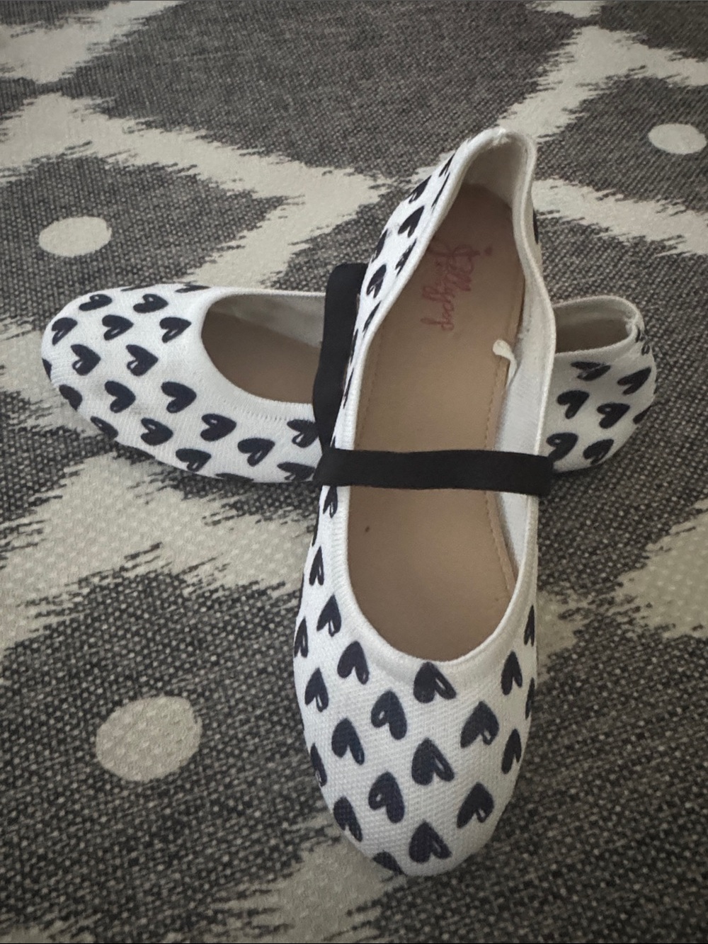 Jellypop White Ballet Flats with Black Heart Print and Black Strap
